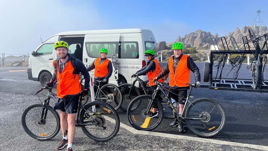 From Hobart: Mt Wellington Summit & Rainforest Bike Tour - Rainforest transfer: from open summit air to temperate green